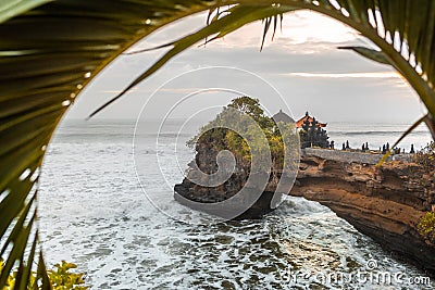 Tanah Lot water temple in Bali at sunset. The famous Hindu temple main landmark of Bali. Indonesia. Stock Photo