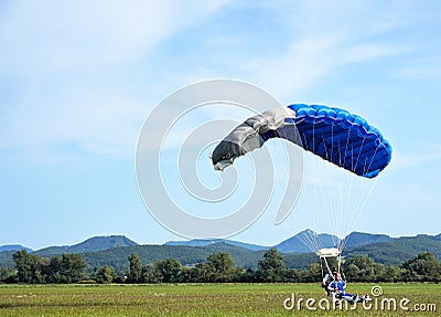 Tandem parachute jump at the moment of landing shot Editorial Stock Photo