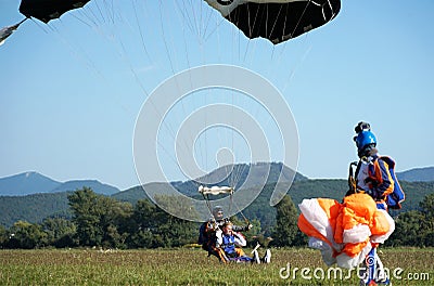 Tandem parachute jump at the moment of landing shot Editorial Stock Photo