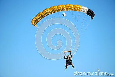 Tandem parachute jump shortly before the moment of landing shot Editorial Stock Photo