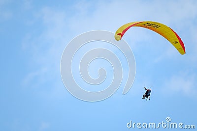 Tandem paragliders flying in the cloudy sky Editorial Stock Photo