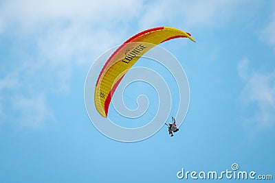 Tandem paragliders flying in the cloudy sky Editorial Stock Photo