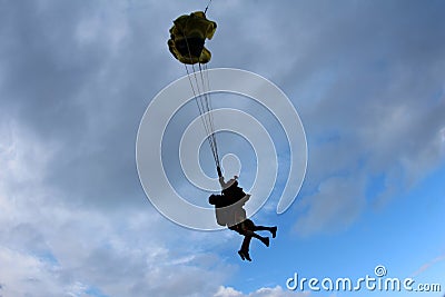 Skydiving. Tandem jump. Man and young woman are falling in the sky together. Stock Photo