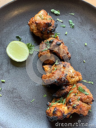 Tandoori Style Chicken with green chutney Stock Photo