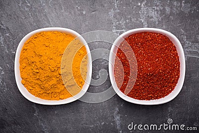 Tanduri masala and kurkuma in white bowl on slate background. Stock Photo