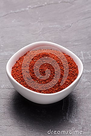 Tanduri Masala spice powder in white bowl on dark slate background. Stock Photo