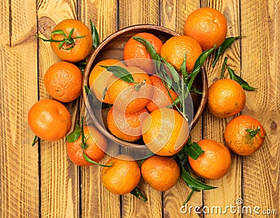 Tangerine fruits over old wooden background, top view, overhead Stock Photo