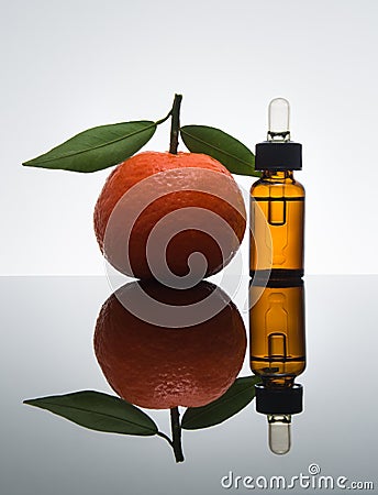 Tangerine / Mandarin essential oil bottle with dropper Stock Photo