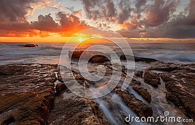 Tangerine sunrise over the ocean Stock Photo