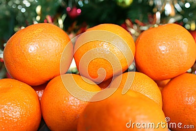 Tangerines on the background of the Christmas tree Stock Photo