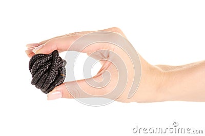 Tangle of black rope in hand Stock Photo