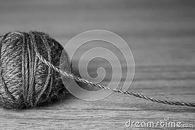 Tangle of knitting threads on the table and space for text, black and white photo Stock Photo