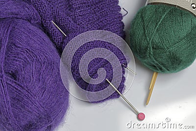 Tangle thread for knitting. Knitting needles are stuck into it. Stock Photo