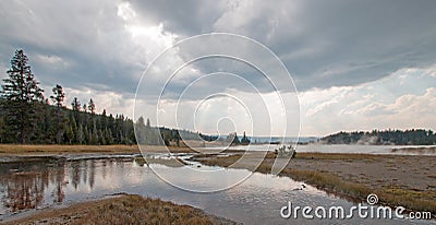 Tangled Creek emptying into Hot Lake hot spring in the Lower Geyser Basin in Yellowstone National Park in Wyoming USA Stock Photo