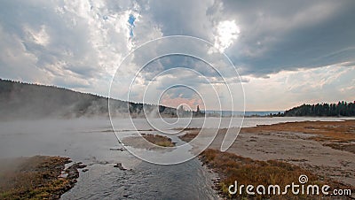 Tangled Creek emptying into Hot Lake hot spring in the Lower Geyser Basin in Yellowstone National Park in Wyoming USA Stock Photo