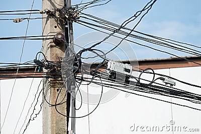 Tangled Electrical Wire on Electricity Post Stock Photo