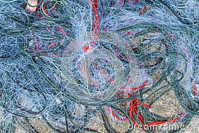 Tangled fouled blue used fishing nets Stock Photo