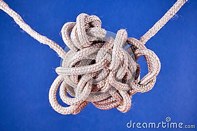 A tangled knot on a rope Stock Photo