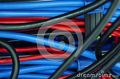 Tangled network cables and wires in server room Stock Photo