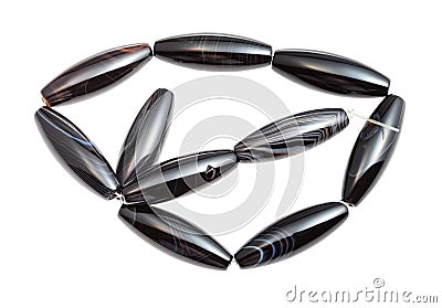 Tangled string from black polished agate beads Stock Photo