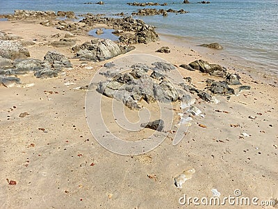 Tanjung Kalian Coastline With Natural Rocky Expanses In Summer Stock Photo