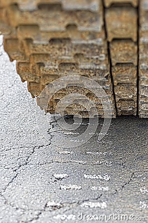 Tank Caterpillar Traces on the Asphalt Stock Photo