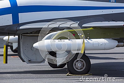 Tank under wing on a modern jet fighter. Stock Photo