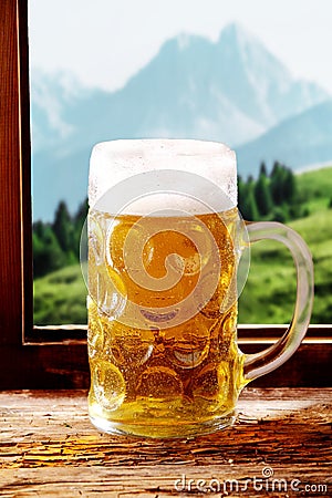 Tankard of ice cold beer in a tavern Stock Photo