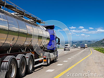 Tanker with chrome tanker on the highway. Stock Photo