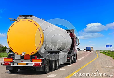 Tanker with chrome tanker on the highway. Stock Photo