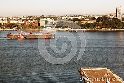 A tanker passing by Hudson river and New Jersey skyline from NYC Stock Photo