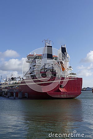 Tanker ship in operations at the Oil Terminal Stock Photo