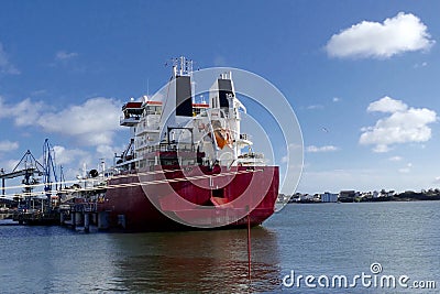 Tanker ship in operations at the Oil Terminal Stock Photo