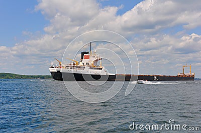 Tanker Ship and Speed Boat in the Thousand Islands Editorial Stock Photo