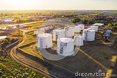 Tanks with petroleum products are among fields near the village. The view from the top. aerial view. refuelling Stock Photo