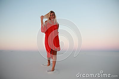 Tanned beautiful girl on the beach on the sands Stock Photo