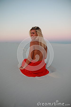 Tanned beautiful girl on the beach on the sands Stock Photo