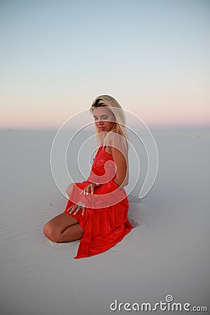 Tanned beautiful girl on the beach on the sands Stock Photo