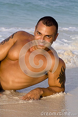 Tanned Male Model Lying Down Stock Photo
