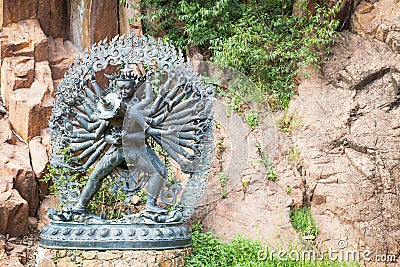 Tantric Deities statue in Ritual Embrace located in a mountain g Stock Photo