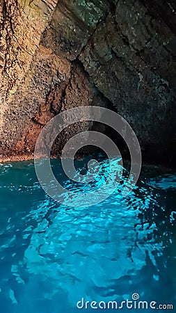 Taormina - Sea cave Blue Grotto (Grotta Azzurra) near Isola Bella in Taormina, Sicily, Italy, Europe, EU. Stock Photo