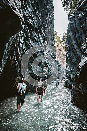 Tourists walking in Alcantara Gorge and Alcantara river park in Sicily Island, Italy. Editorial Stock Photo