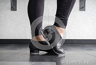 Tap dancer at the barre in dig Stock Photo