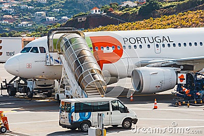 TAP Portugal Airbus A319-111 at Funchal Cristiano Ronaldo Airport, boarding passengers.This airpo Editorial Stock Photo