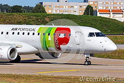 TAP Portugal Express Embraer 190 airplane Porto airport in Portugal Editorial Stock Photo