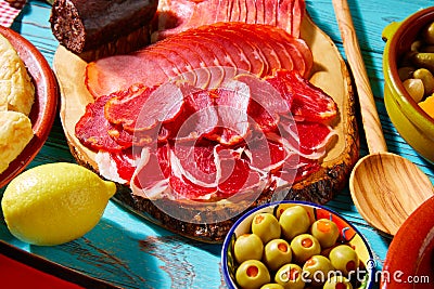Tapas Iberico ham and lomo sausage olives Stock Photo