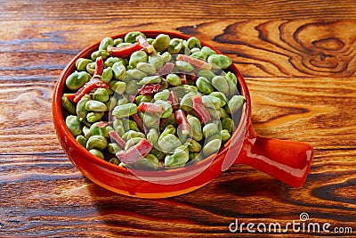 Tapas lima beans with iberico ham from Spain Stock Photo