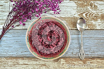 Tape Ketan, a snack made from steamed red glutinous rice, after it has cooled, it is given yeast and then fermented Stock Photo