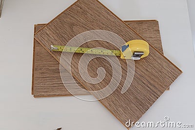 DIY do it yourself project measurement for cutting or fitting wood tape measures Stock Photo