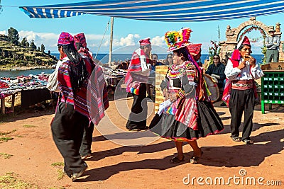 Musicians and dancers in the peruvian Andes on Taquile Island. Puno, Peru Editorial Stock Photo
